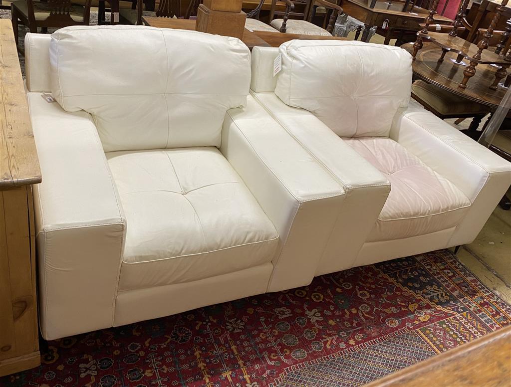 A pair of contemporary white leather armchairs, width 104cm, depth 98cm, height 88cm